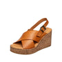 Brown wedge sandal with cork sole on a white background
