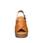 Brown sandal with cork wedge sole on a white background