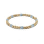 Bracelet with gold beads and light blue accents on a white background