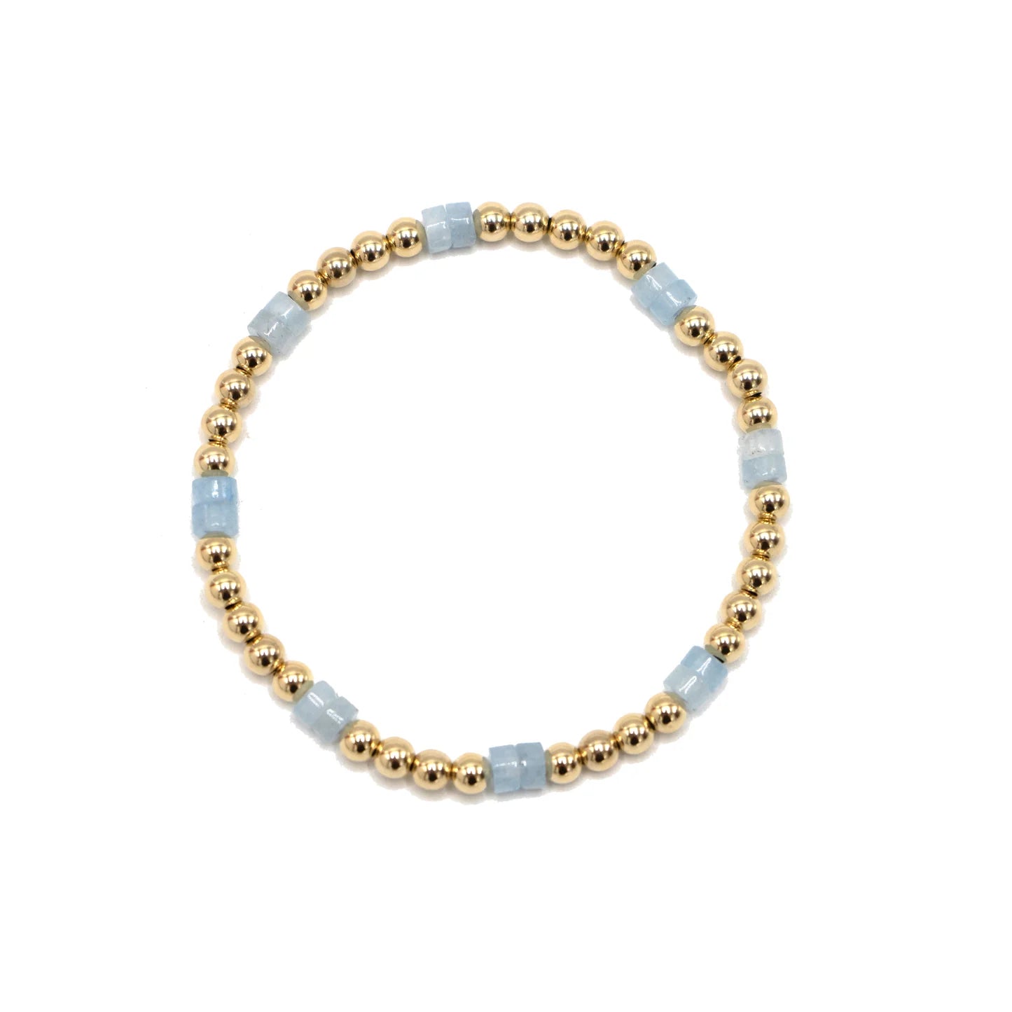 Bracelet with gold beads and light blue stones on a white background