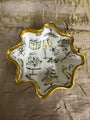 Decorative plate with wedding-themed illustrations on a textured brown background