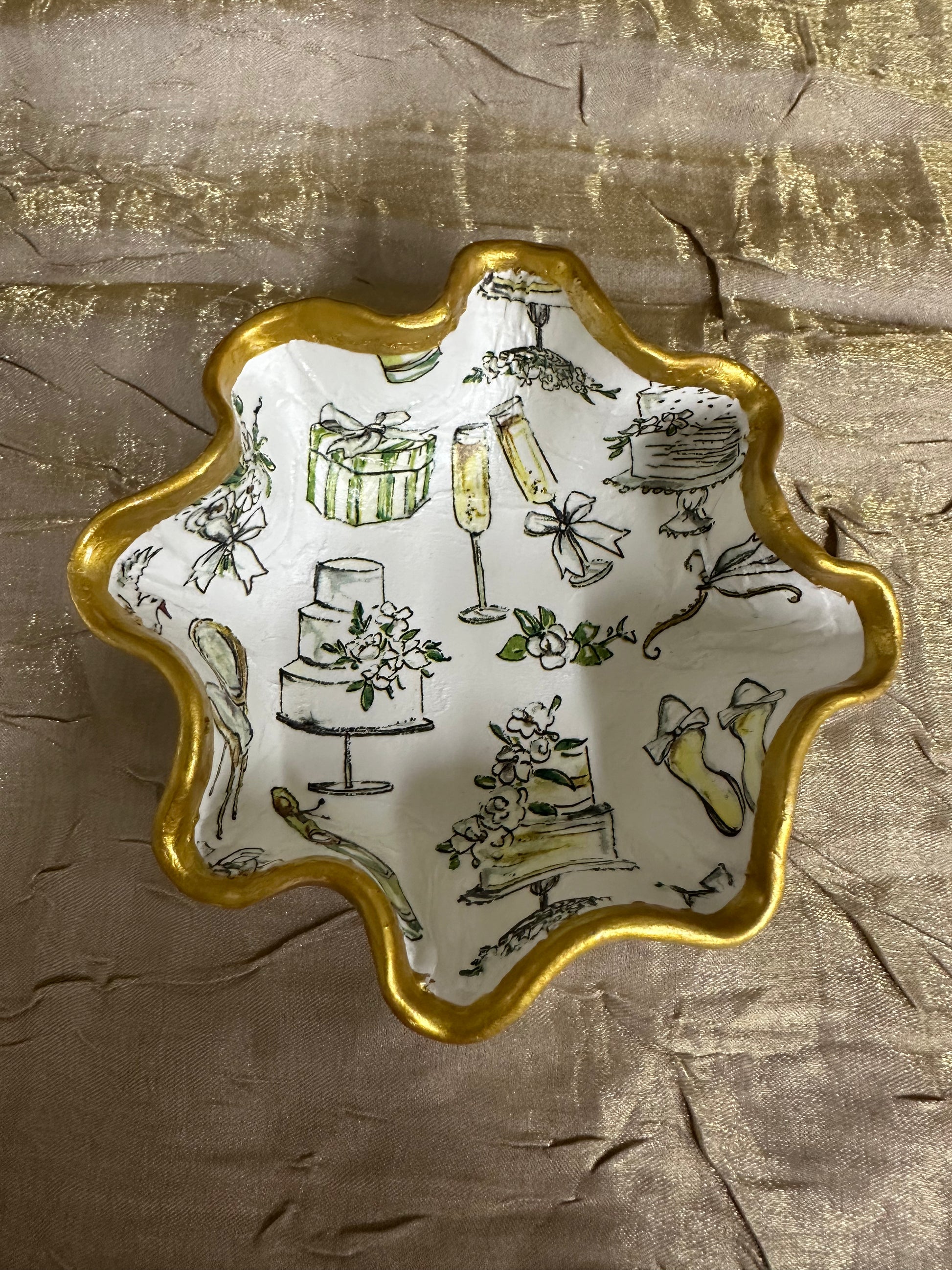 Decorative plate with wedding-themed illustrations on a textured brown background