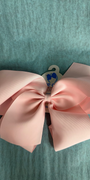 Pink bow on a textured green background