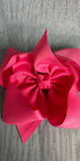Pink bow on a gray textured background