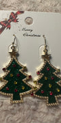 Christmas tree earrings with star on top and red and gold ornaments on white card saying Merry Christmas with red and gold bow