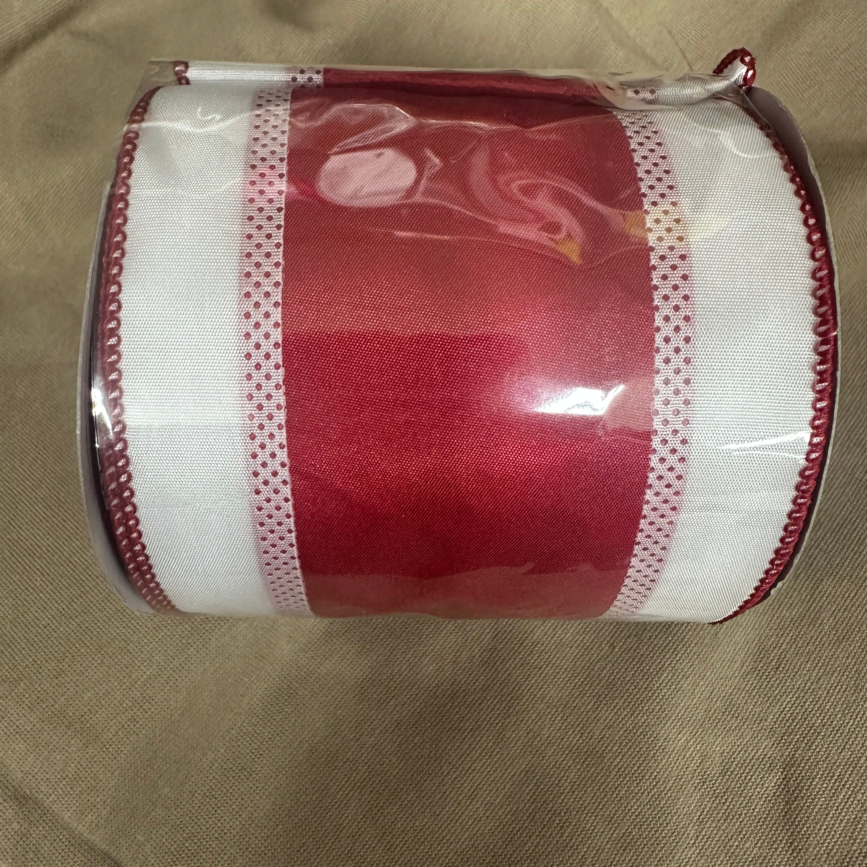 Red and white wired ribbon roll with dot mesh border and wired edge