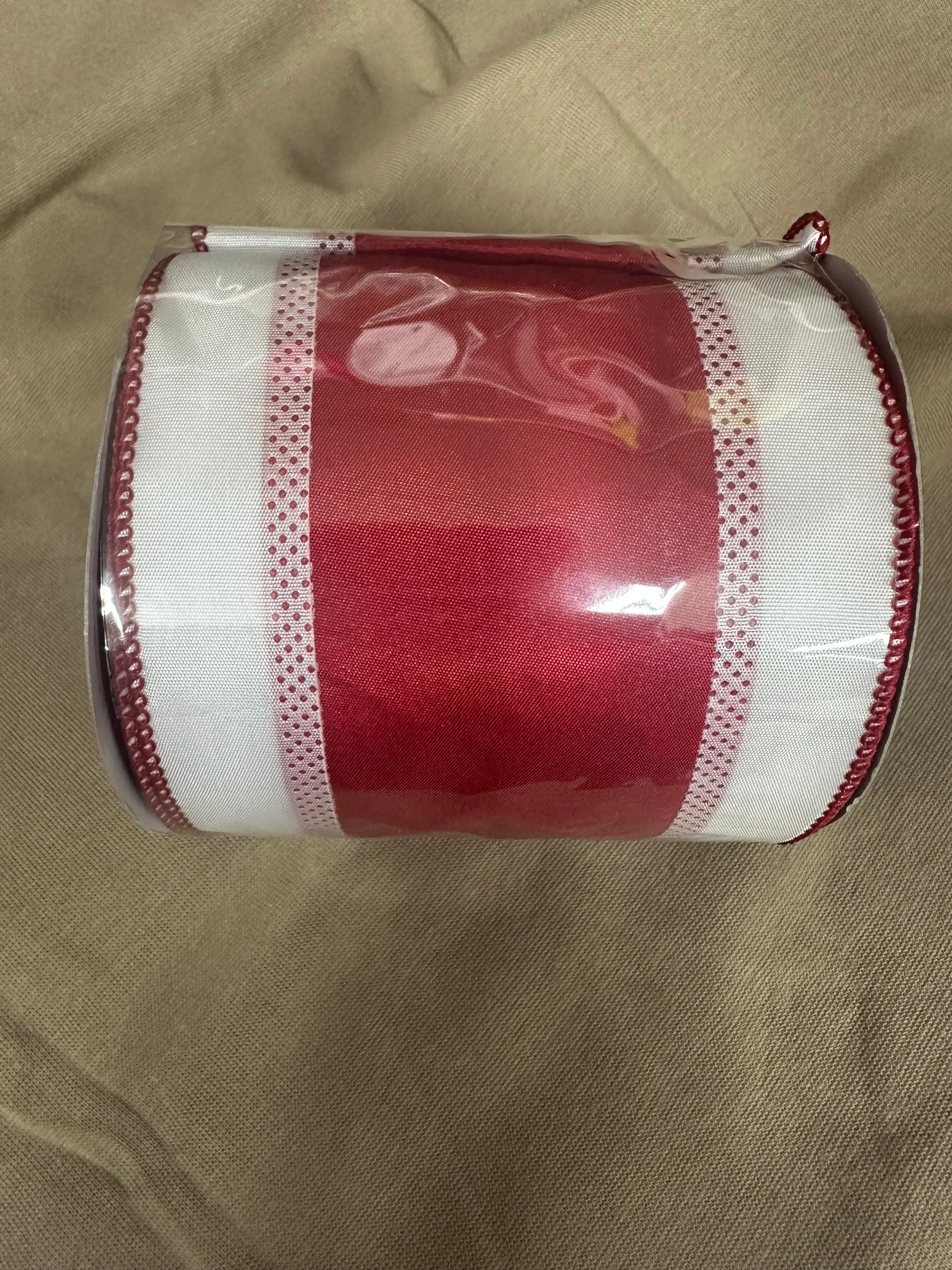 Red and white wired ribbon roll with dot mesh border and wired edge