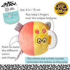 Toy with colorful design and text describing features, on a patterned background
