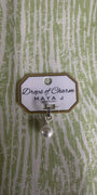 Drops of Charm white gold charm with pearl on green and white background