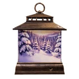 A decorative lantern-shaped light with a dark brown wood-grain frame and a glowing winter forest scene on the front panel, shown against a plain white background.
