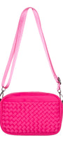 Pink quilted handbag with a strap on a white background