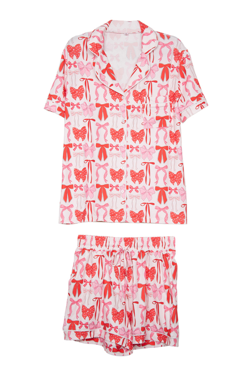 Pink and red patterned pajama set on a white background