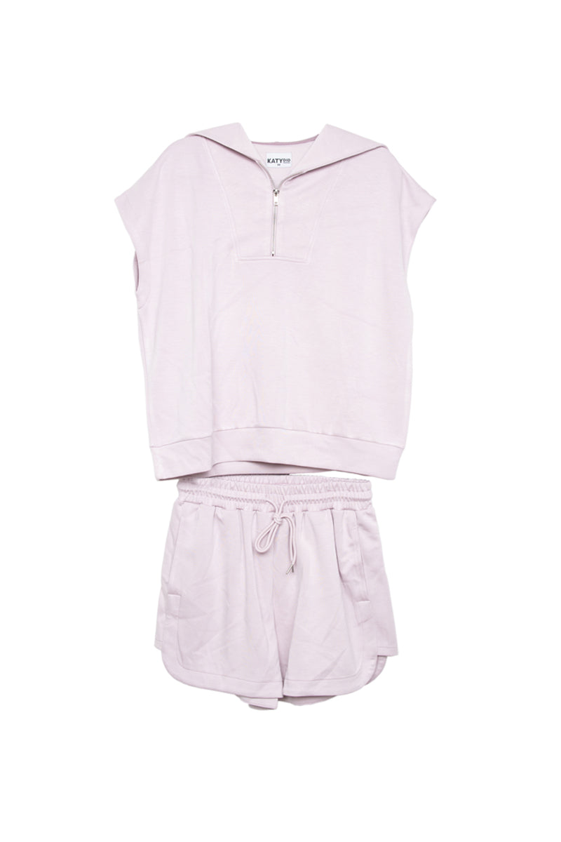 Light pink sleeveless top and shorts set on a white background