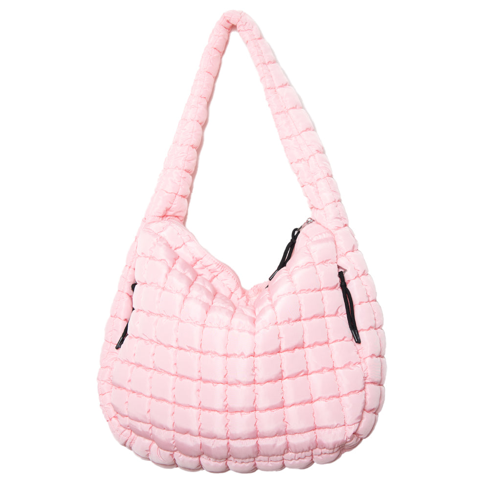 Pink quilted handbag with black zippers on a white background
