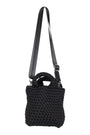 Black textured handbag with a strap on a white background