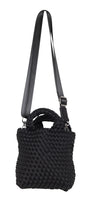 Black textured handbag with a strap on a white background