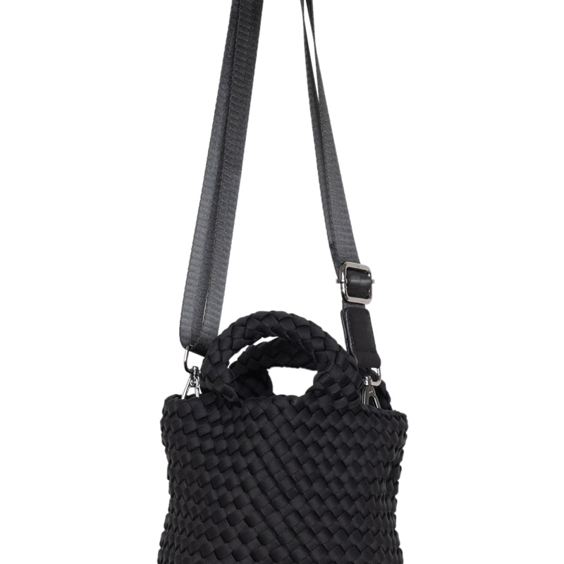 Black textured handbag with a strap on a white background