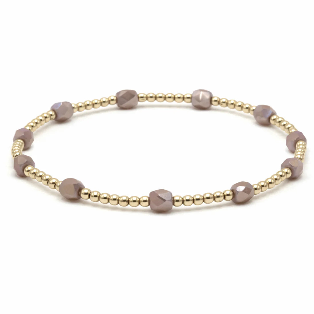 Bracelet with gold and mauve beads on a white background