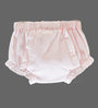 A pair of light pink baby bloomers with a gathered elastic waistband and ruffled trim, shown against a solid gray background.