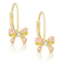 Gold bow-shaped earrings with pink enamel and a diamond on a white background