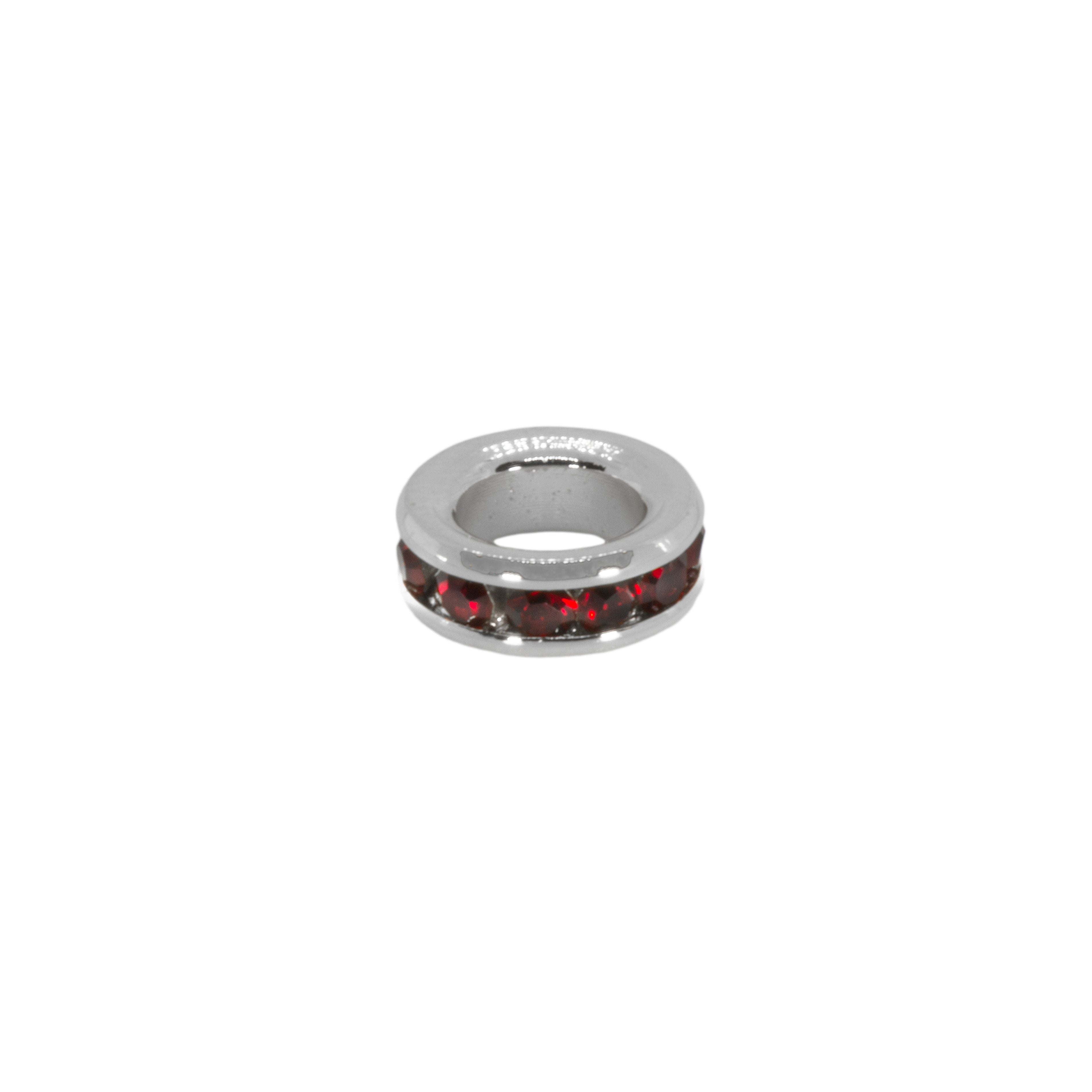 Silver ring with red stones on a white background