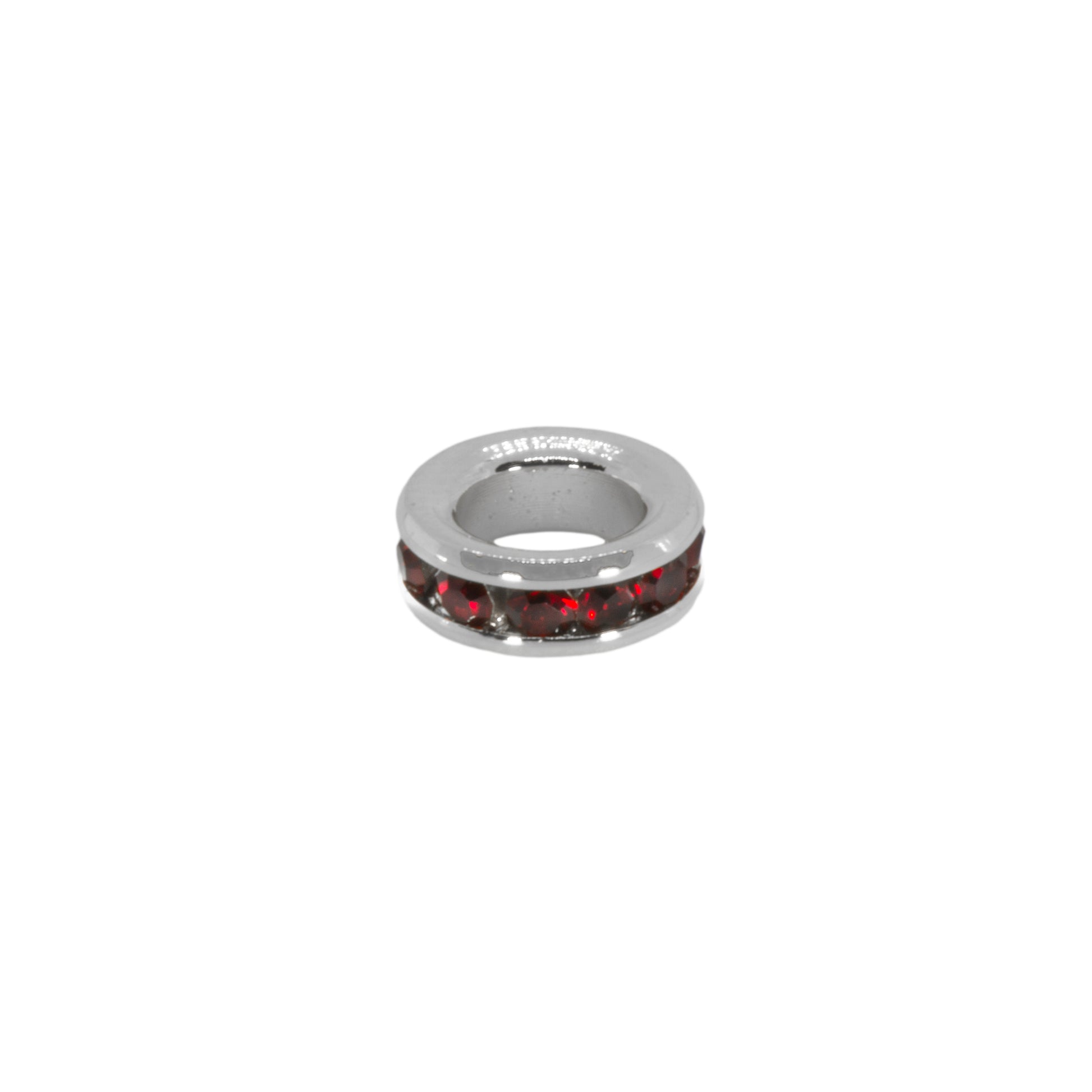 Silver ring with red stones on a white background