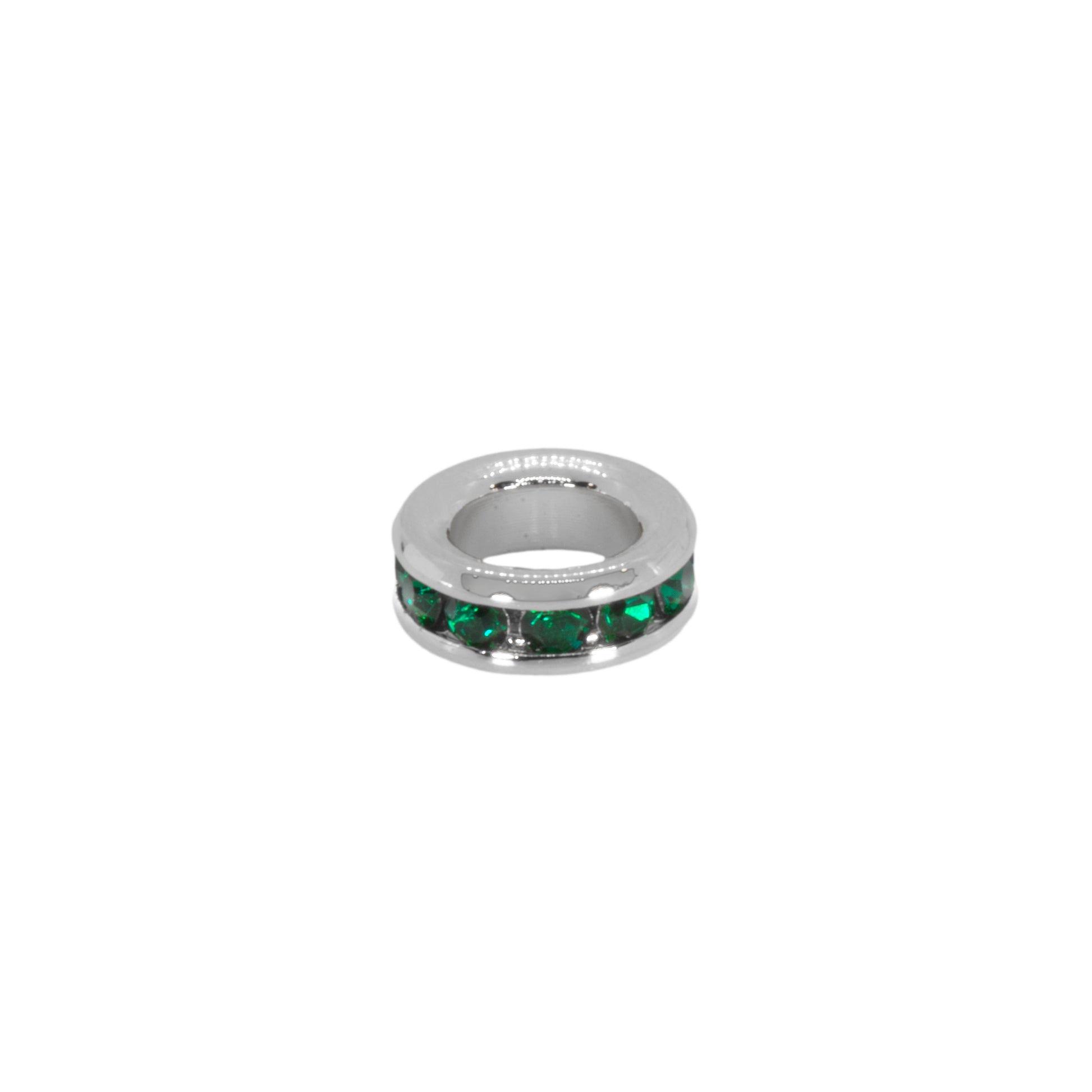 Silver ring with green gemstones on a white background