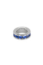 Silver ring with blue gemstones on a white background