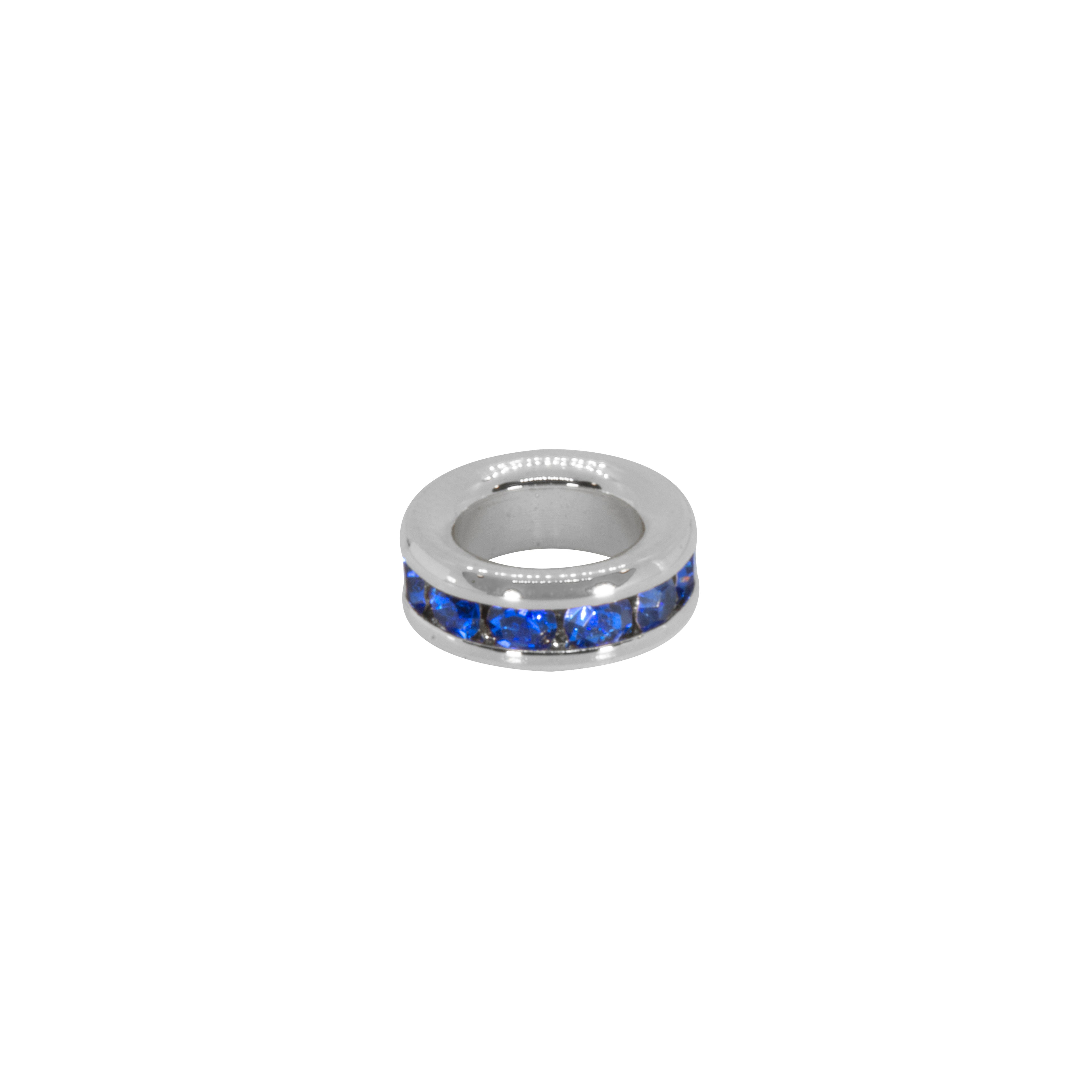Silver ring with blue gemstones on a white background