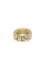 Gold ring with embedded crystals on a white background