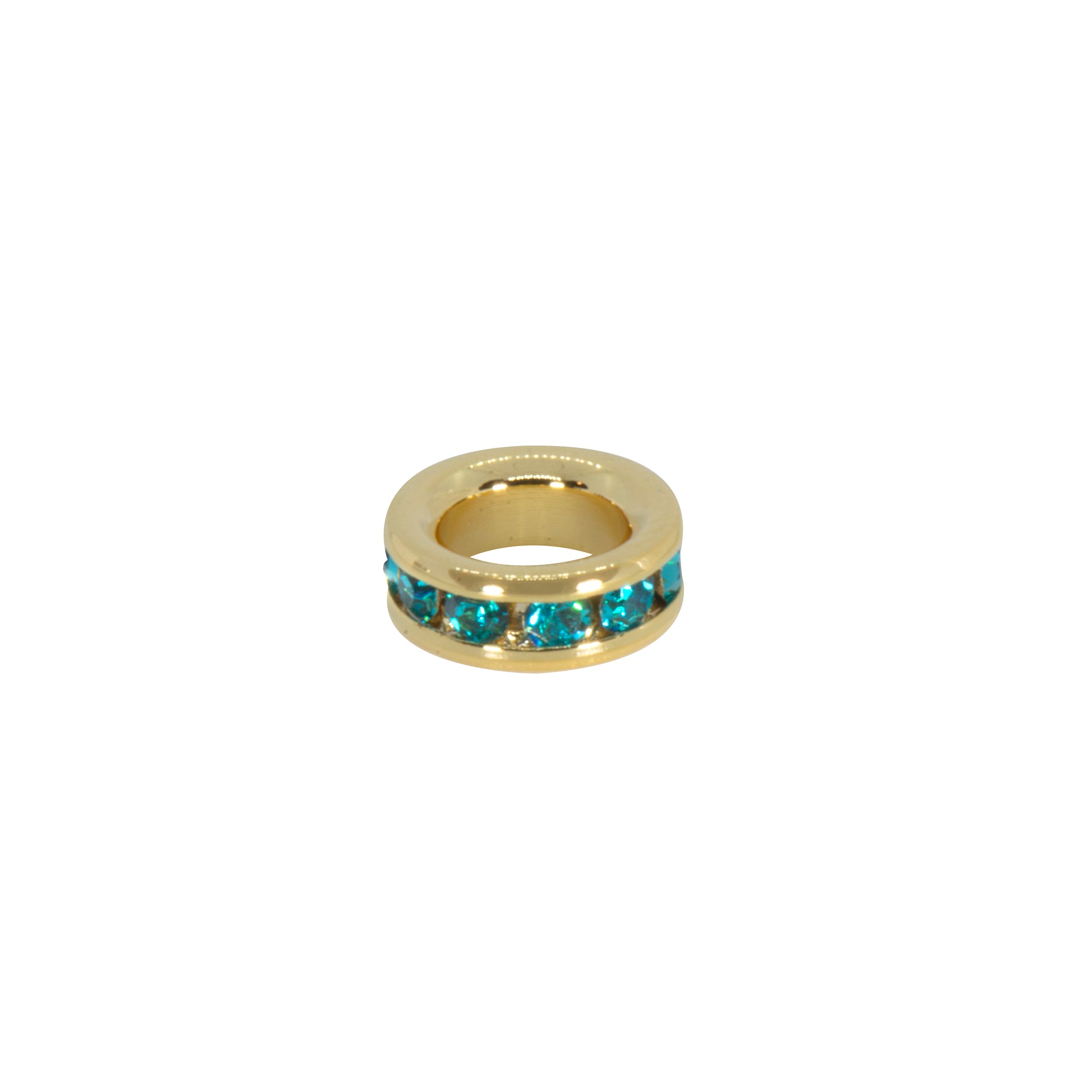 Gold ring with blue gemstones on a white background