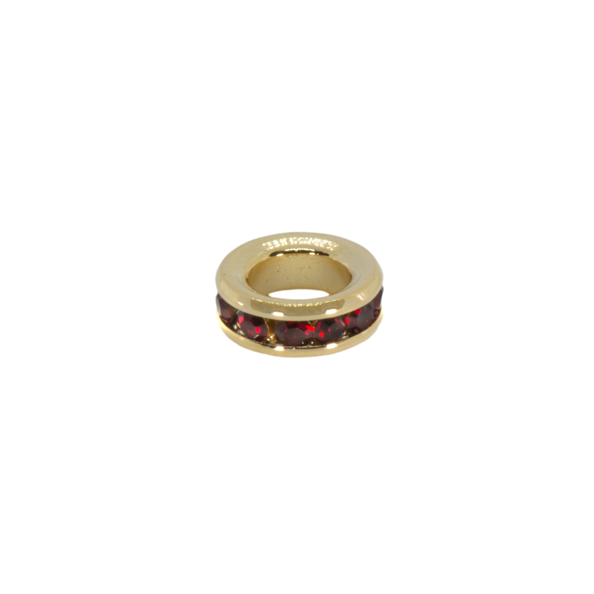 Gold ring with red stones on a white background
