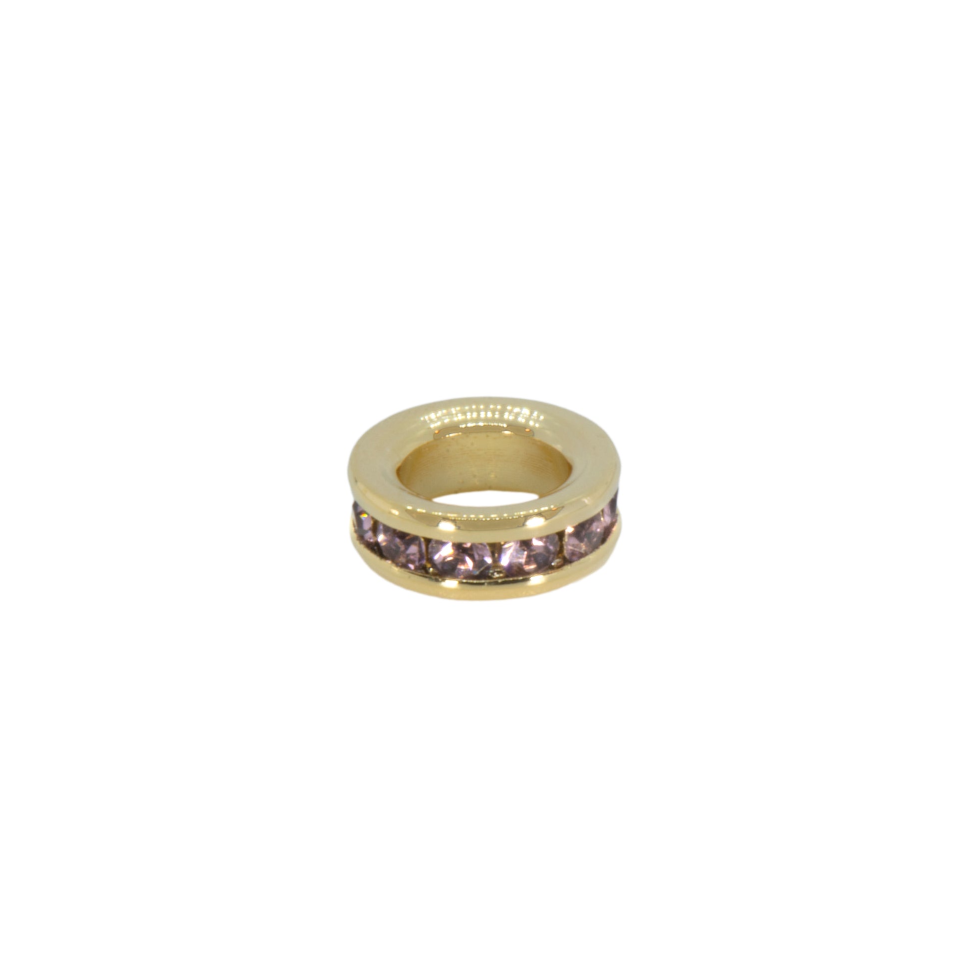 Gold ring with embedded stones on a white background