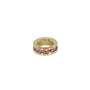 Gold ring with pink gemstones on a white background