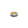 Gold ring with blue stones on a white background