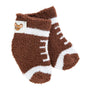 Brown fuzzy socks with white accents on a white background