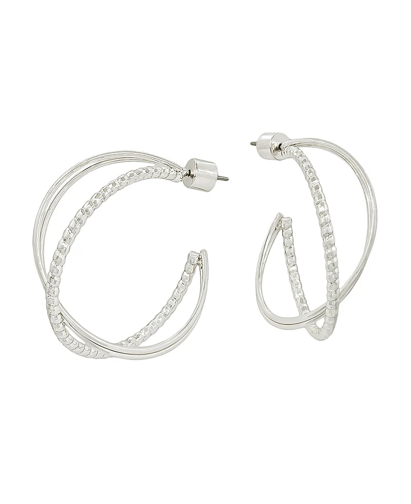 A pair of silver hoop earrings with a double-band twisted design, featuring clear pavé-set stones along the front bands, shown against a plain white background.
