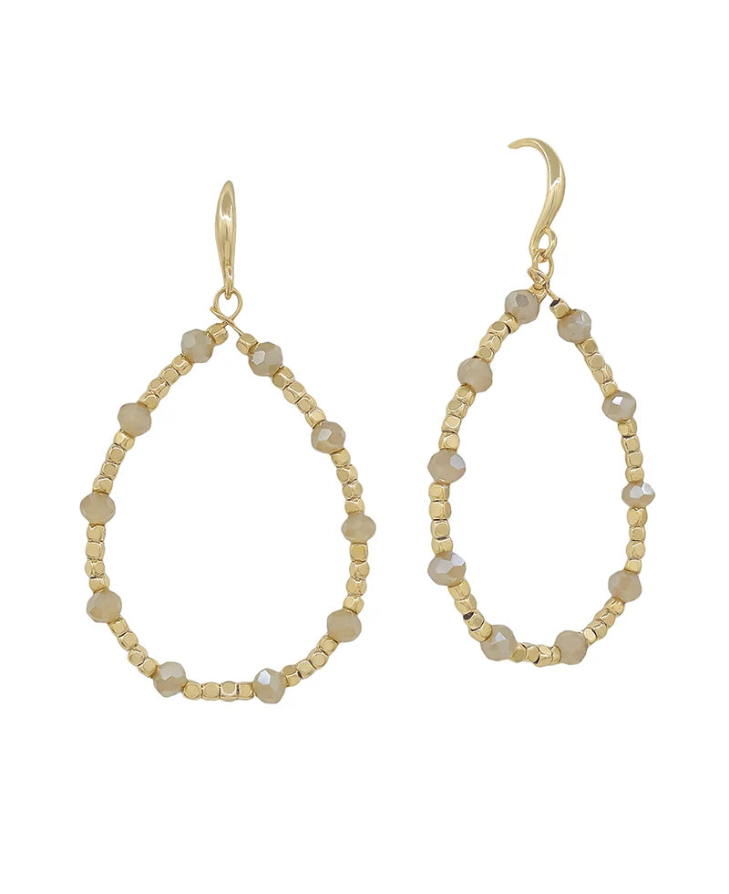 Pink and neautral  beaded earrings on a white background