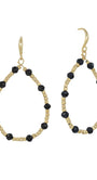 A pair of gold-tone teardrop dangle earrings with faceted black beads spaced along the open oval frame, shown on a plain white background.