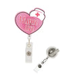 Pink heart-shaped retractable badge reel with 'Nurse Life' text and a white nurse hat graphic, shown with the clear plastic clip and reel attachment on a white background.