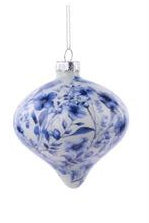 A blue and white floral ornament with a silver cap and hanging loop, shown against a plain white background.
