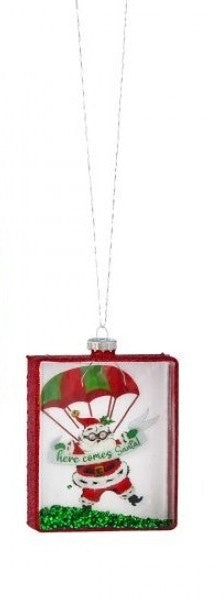 Square glass Santa ornament with red frame, Santa illustration with green canopy and gift