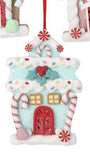 A festive gingerbread house Christmas ornament with a red glittery door, candy cane details, a holly accent, and a red hanging ribbon, shown against a white background.