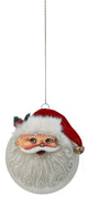 A round white Christmas ornament shaped like Santa's face, featuring a red Santa hat, white beard, and a small gold bell, hanging against a plain white background.
