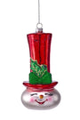 Snowman ornament with tall red top hat, green holly, smiling face, and hanging loop
