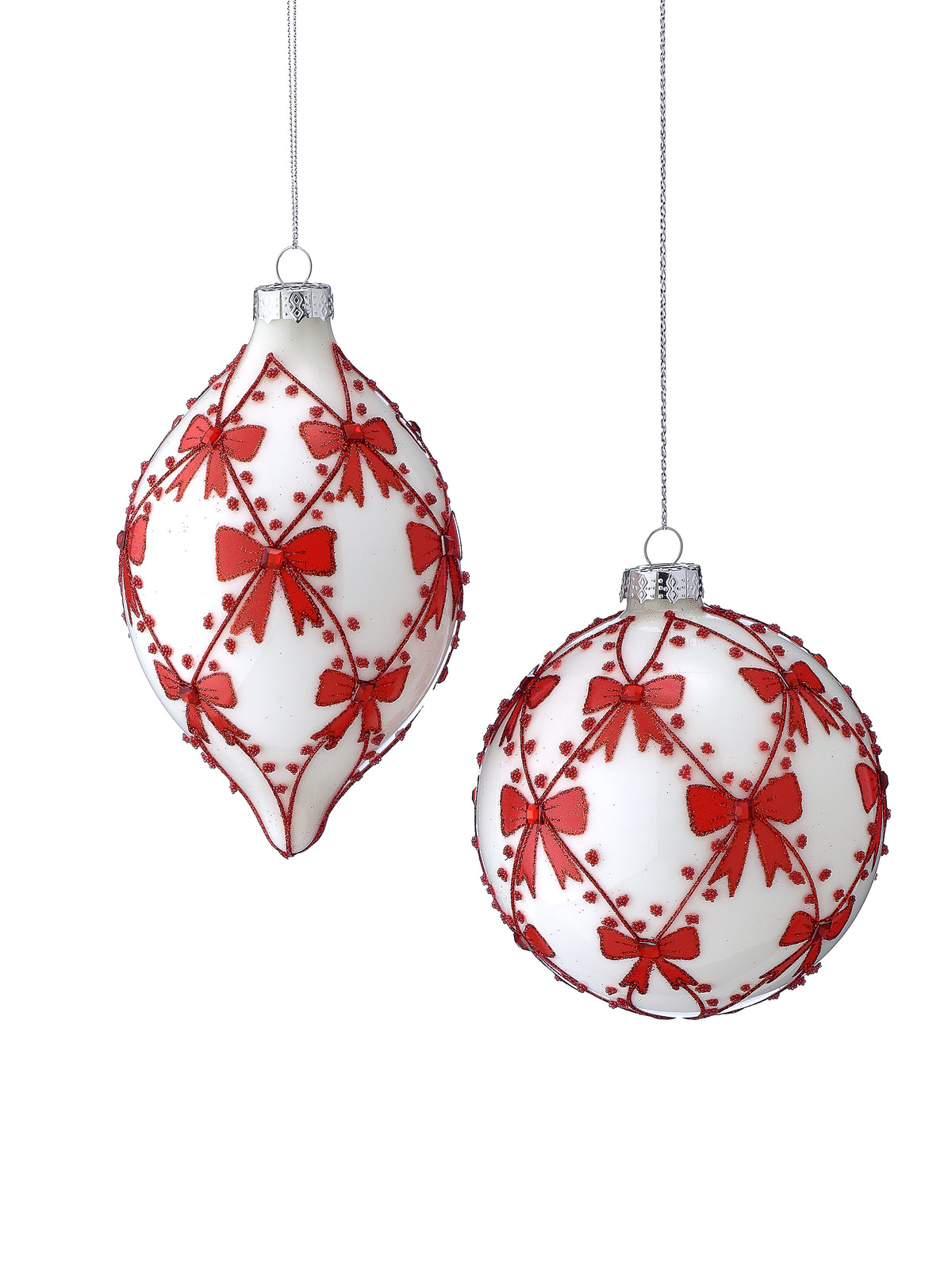 Glass Christmas ornament set with red bow pattern and silver cap, hanging on strings
