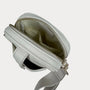 Light gray crossbody bag with a visible zipper on a light gray background