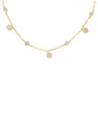 A delicate gold chain necklace featuring multiple small, round pavé-set crystal charms spaced along the chain, displayed against a solid white background.