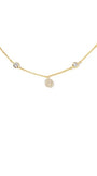 A delicate gold chain necklace featuring multiple small, round pavé-set crystal charms spaced along the chain, displayed against a solid white background.