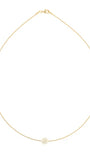 A delicate gold chain necklace with a single small white pearl pendant, displayed against a solid white background.